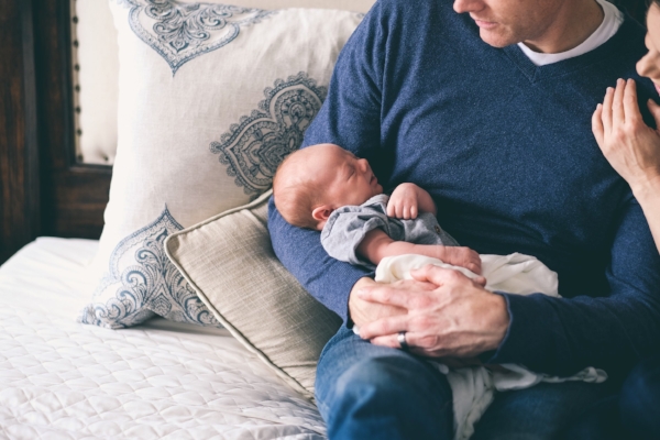 man holding small baby