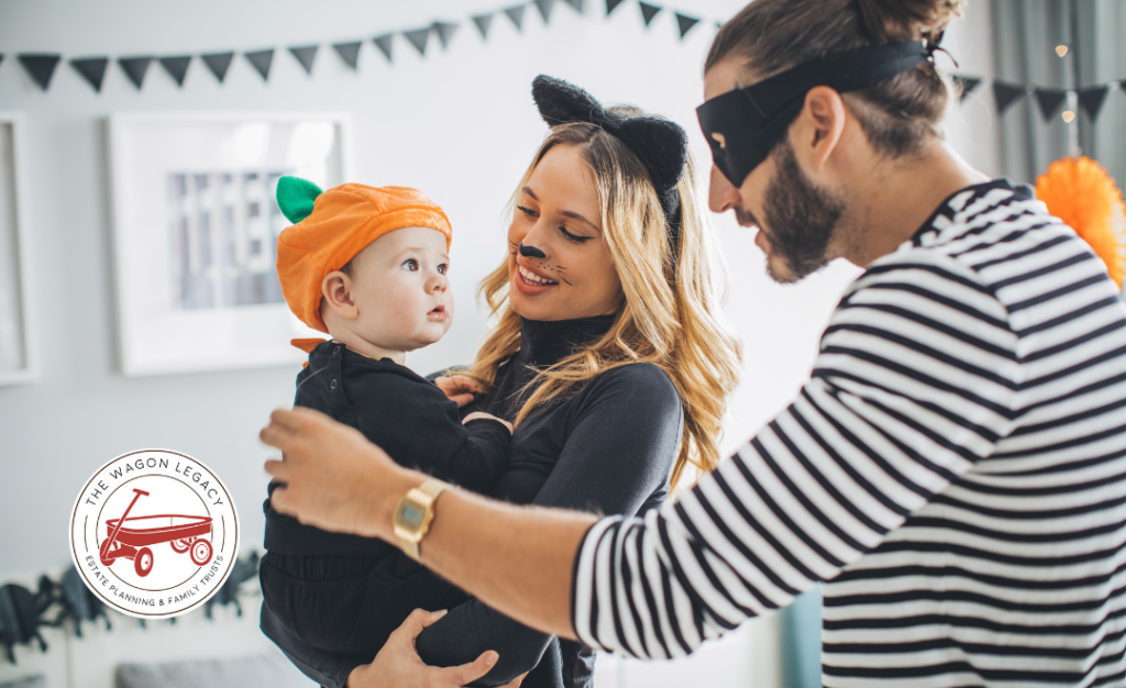 young family dressed in Halloween costumes