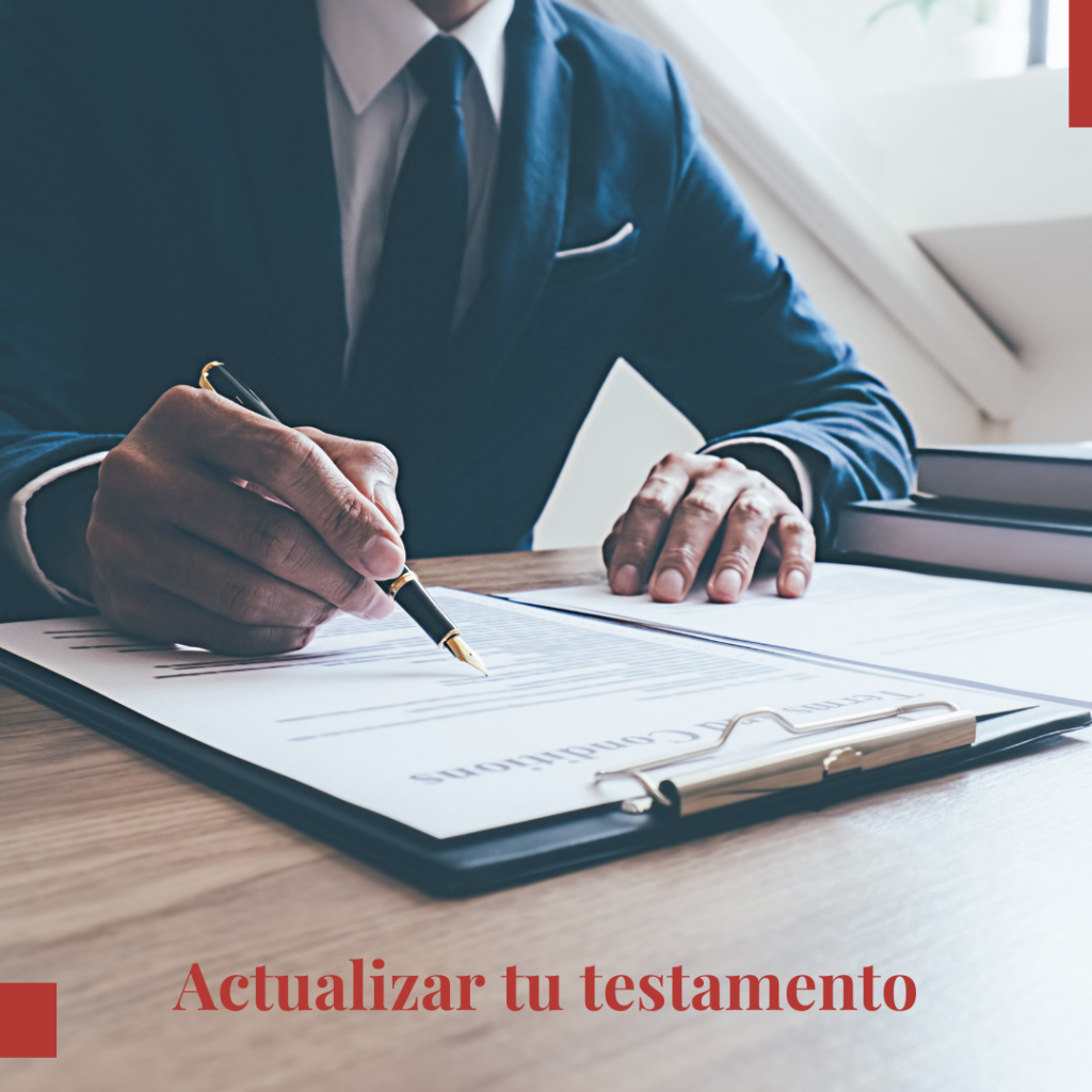 man writing on notepad at desk