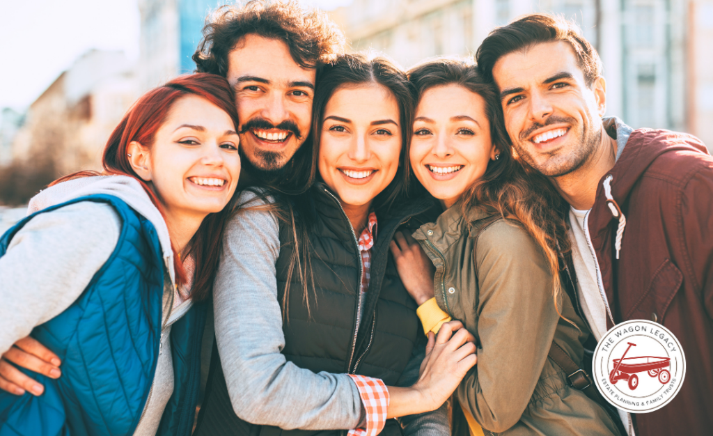 two males and three female friends posing for photo